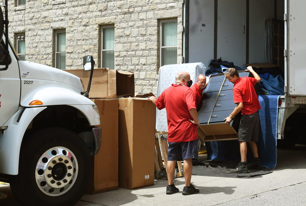 movers unload furniture at Arnold hall