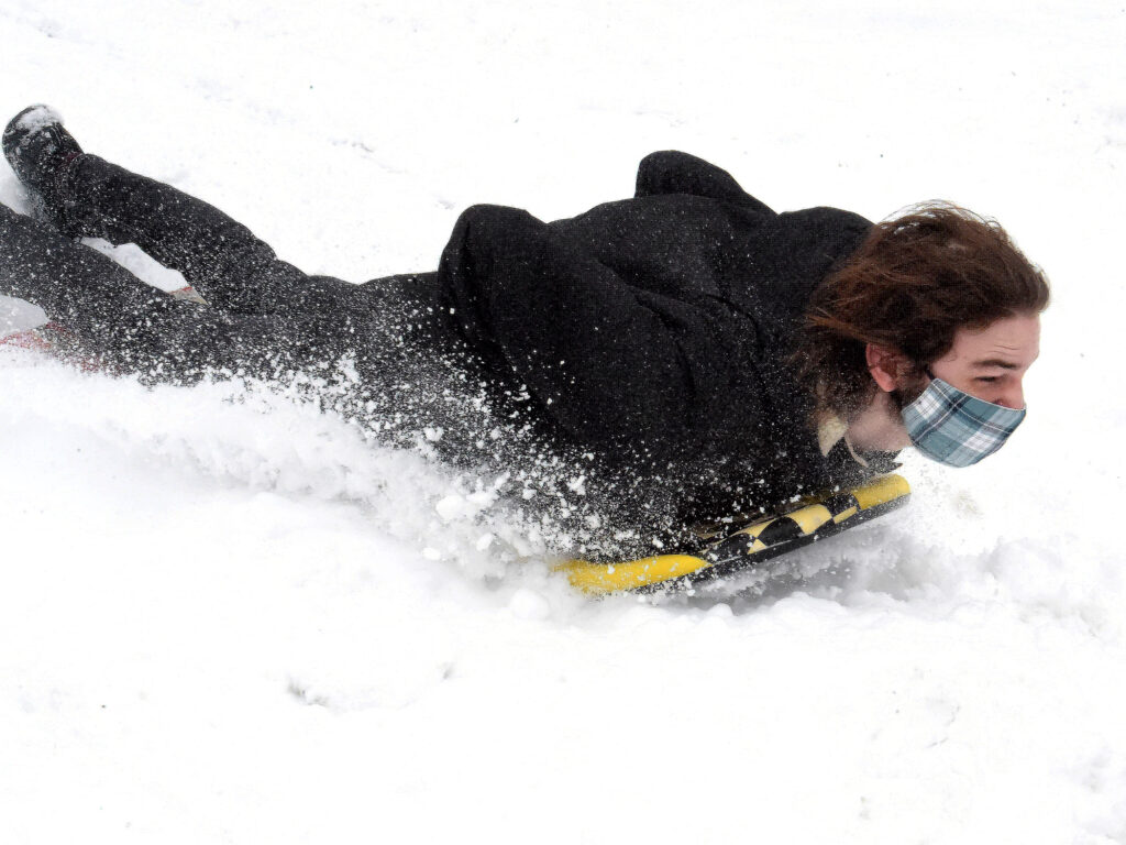 sledding in the snow