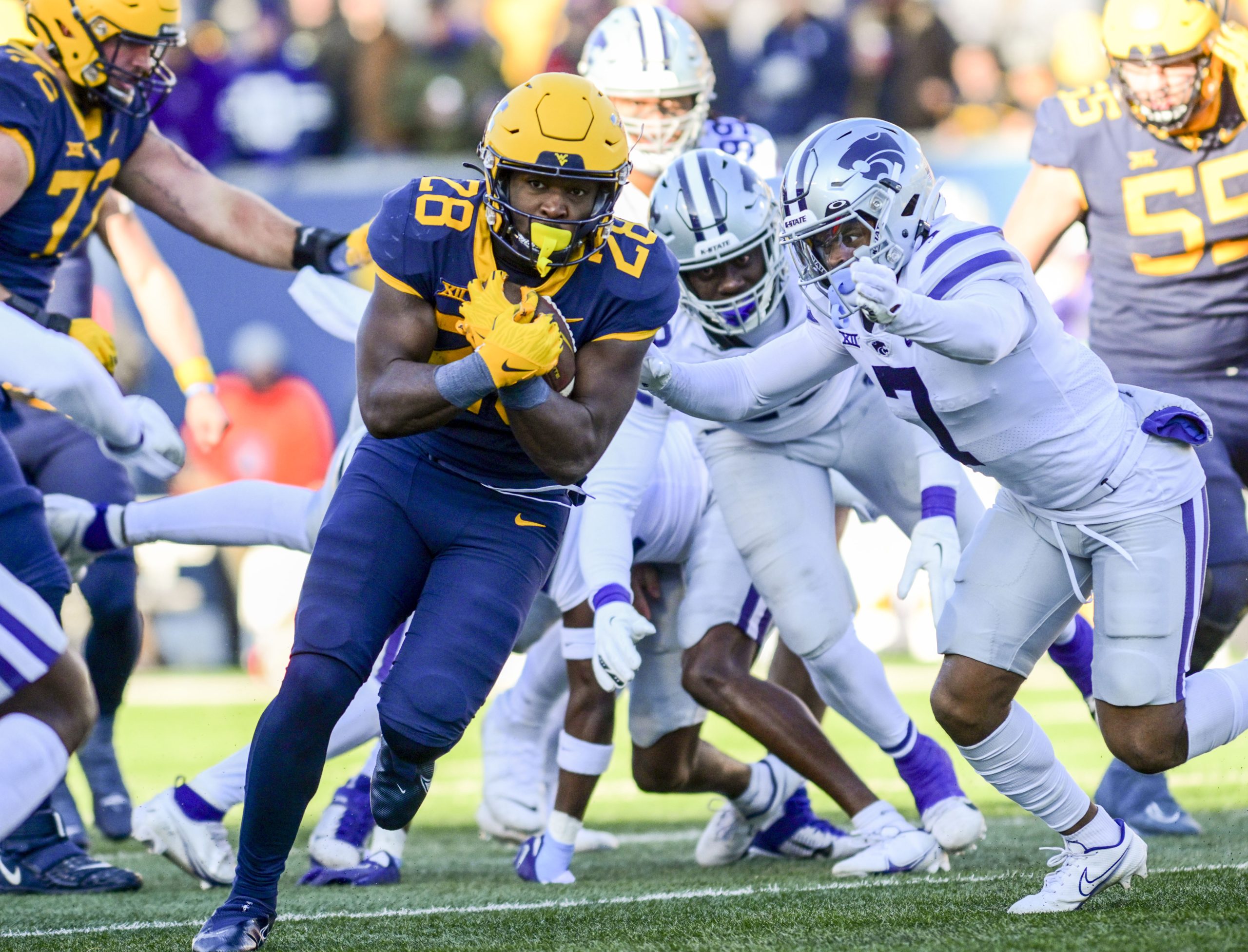 Brown retools offensive staff to maximize WVU's rushing success ...