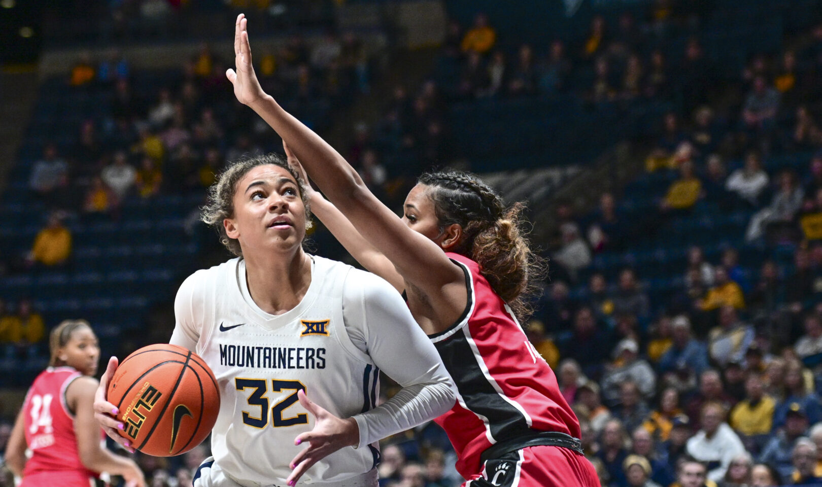 Kyah Watson's 14 points leads a balanced attack, as No. 24 WVU improves ...