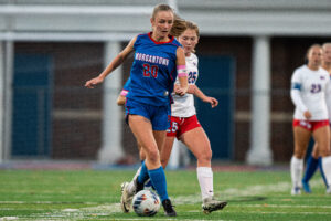 Morgantown's LIllian Staples (20) rushes down center field with the ball against Wheeling Park in sectionals.