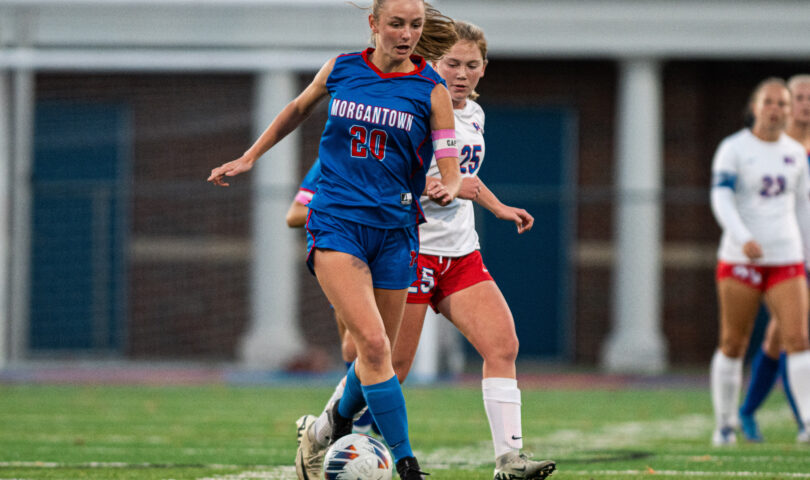 Morgantown's LIllian Staples (20) rushes down center field with the ball against Wheeling Park in sectionals.